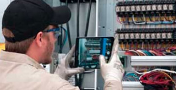 Technician working at an electrical box